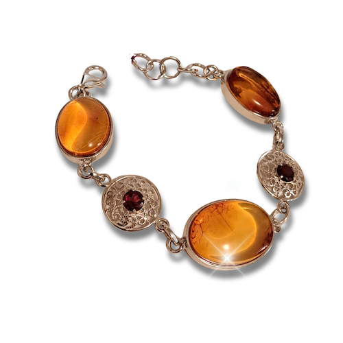 Click to view detail for HW-4046 Bracelet, 3 Oval Amber, 2 Garnets $170